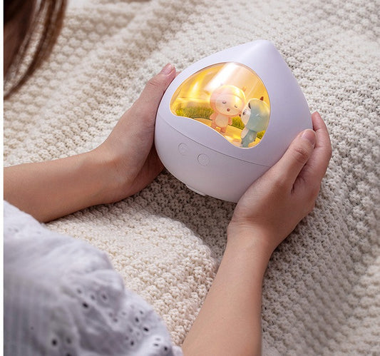 Peach Rotating Music Light held in hands