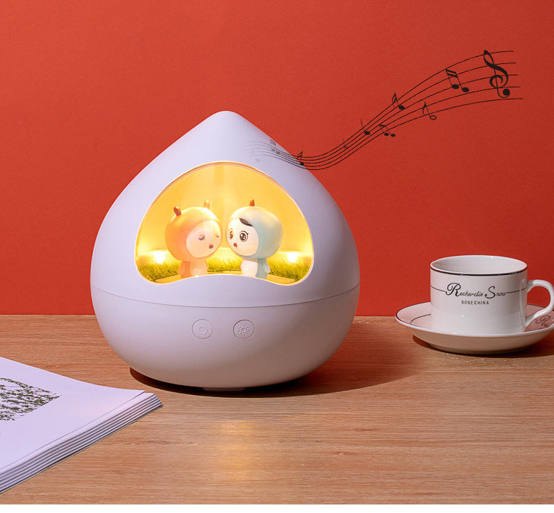 Peach Rotating Music Light on table with music notes
